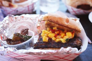 Blackened mahi sandwich with mango salsa and kale chips on the side, offered at the St. Augustine Lions Seafood Festival.