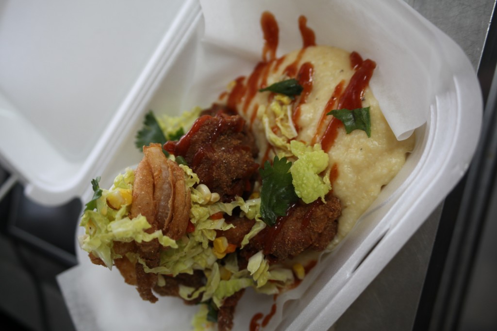 Fried chicken and grits with signature scratch-made sauce by Chef Vinny D'Amato at Uptown Scratch Kitchen food truck, 32 San Marco Ave., in the Solano Cycle parking lot, in uptown St. Augustine, Florida. Photos by Renee Unsworth